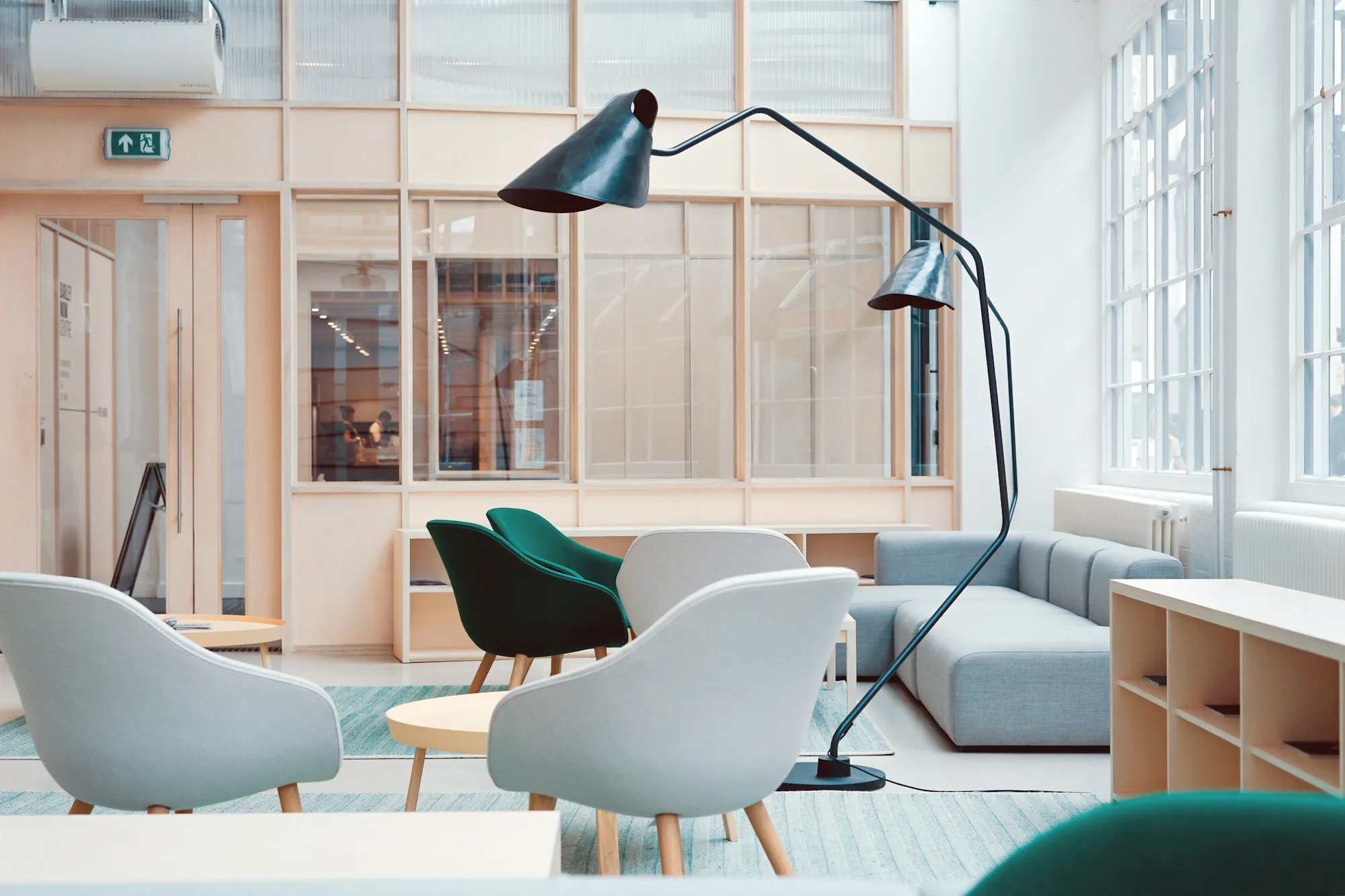 Office lounge with white chairs and soft daylight