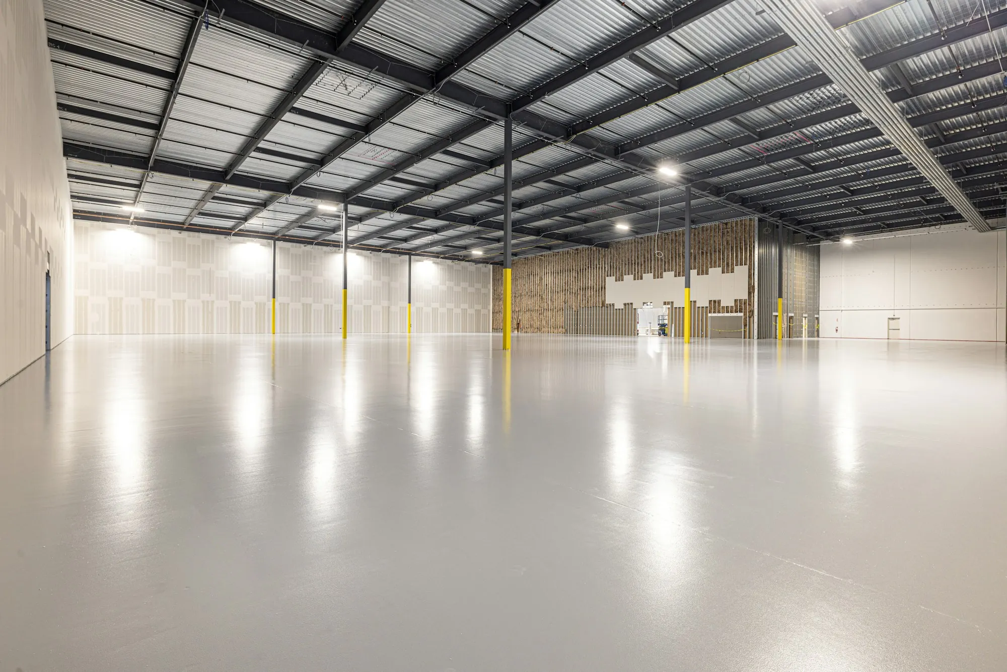 Empty warehouse with a glossy sealed concrete floor